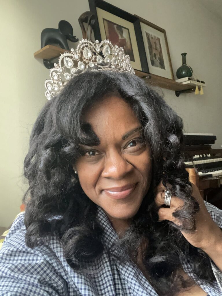 Lisa N. Alexander smiling in a sparkling tiara on her 56th birthday.