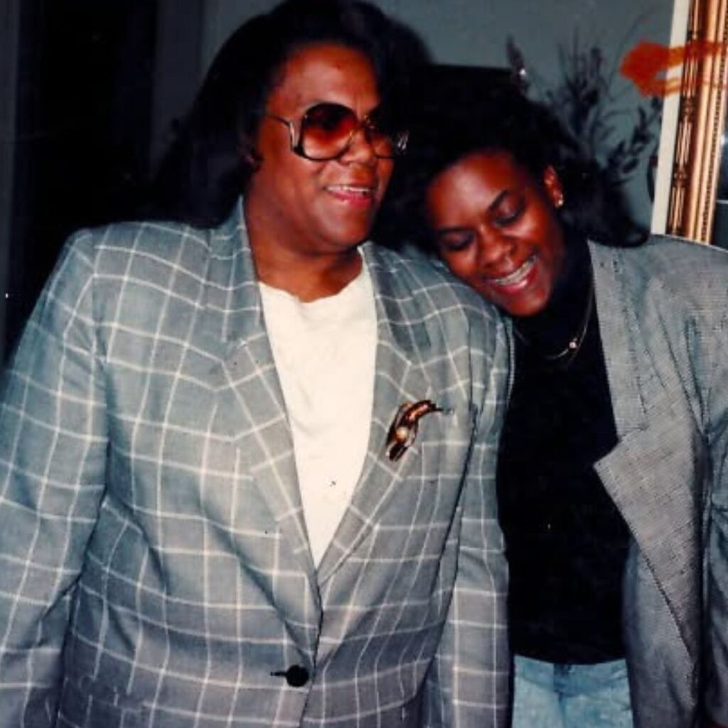 Lisa N. Alexander smiling and leaning affectionately against her mother, Bishop Gwendolyn P. Mack.